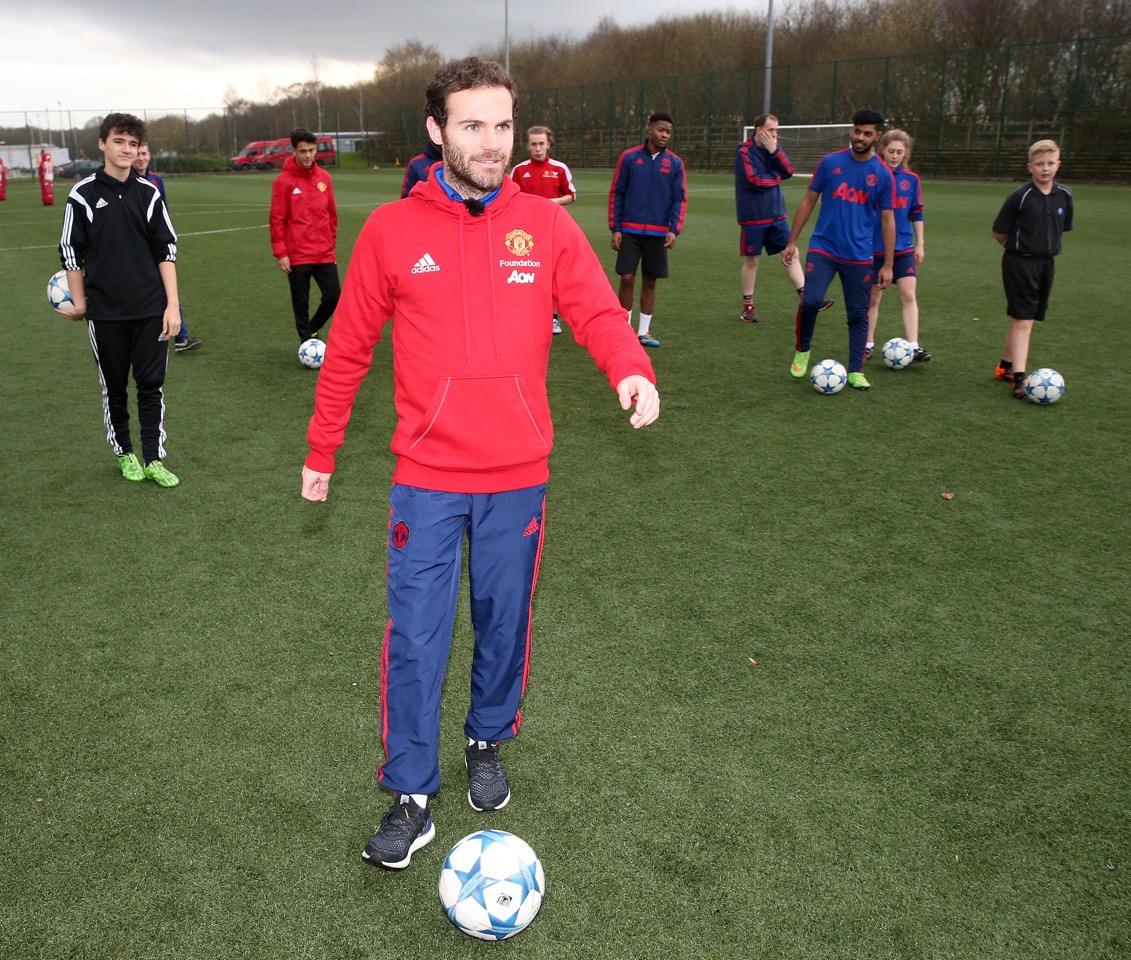 Juan Mata taking part in the Mata Super 8 Challenge Final with Manchester United Foundation participants at the Aon Training Complex